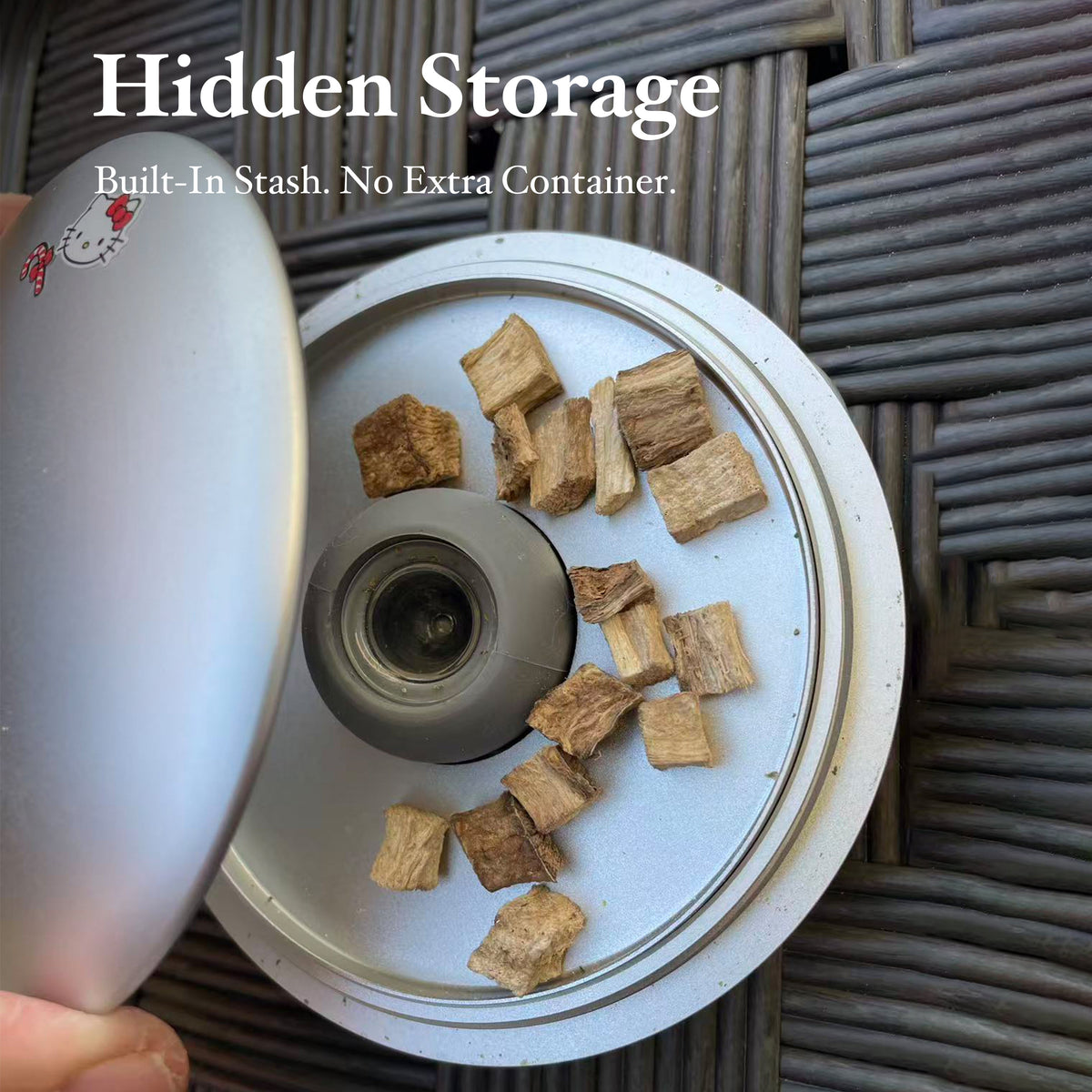 Open SUKA UFO Pipe Showing Its Hidden Storage Chamber, Central Bowl Holder and Material Inside the Tray