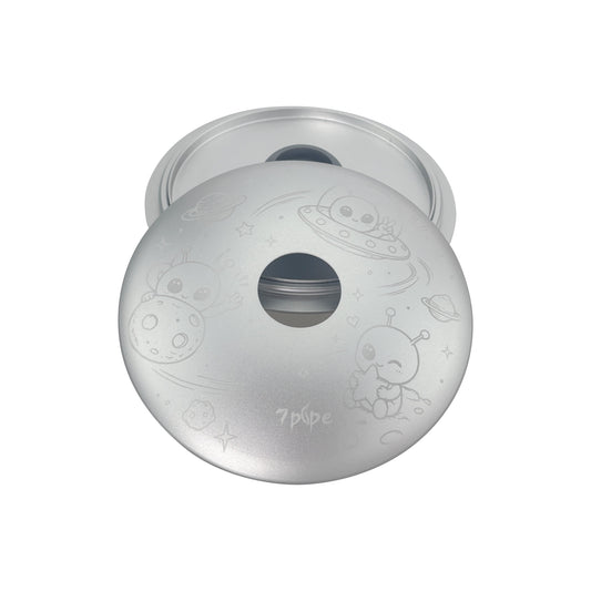 Angled View of the 7pipe SUKA Orbit Alien Edition Showing Its Round Silver Metal Body and Central Opening
